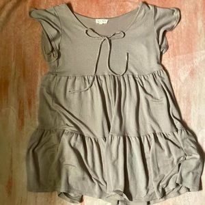 A beige dress from the brand see you Monday